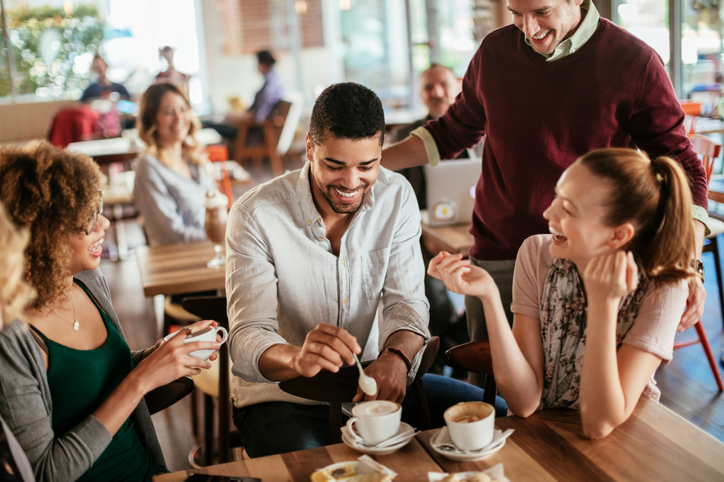 Photo of friends having coffee in cafe