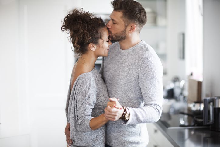 Two Lovers dancing in the kitchen.